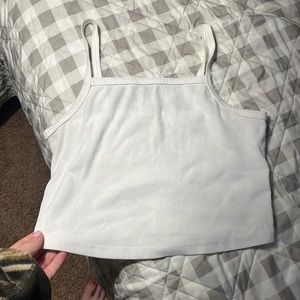 Colsie white tank bralette. Spot on front is tag on the inside peering through